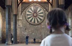 Young girl looking at the round table