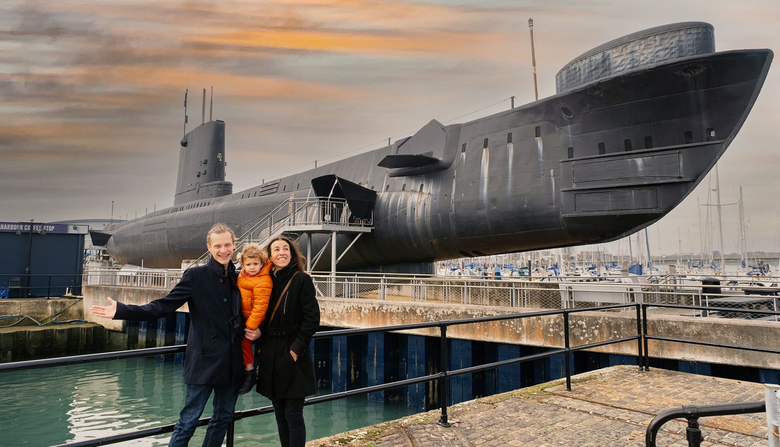 Family next to HMS Alliance at Portsmouth Historic Dockyard