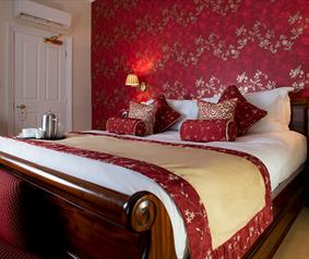 Bedroom at The Clarence Boutique Hotel